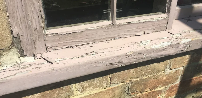 Flaking, cracked paint on the frame