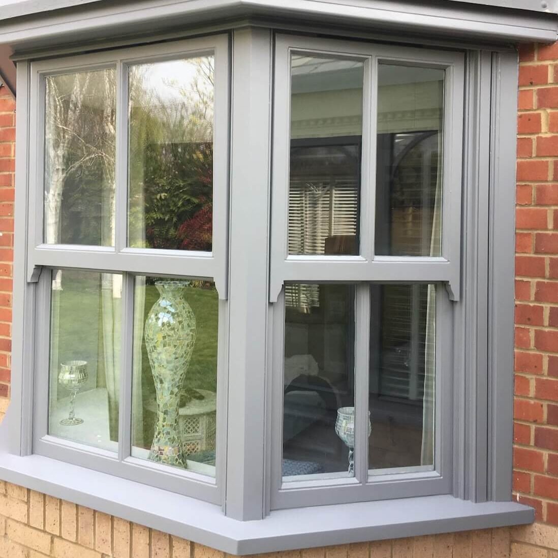 Window painting services — close-up of freshly painted sash windows
